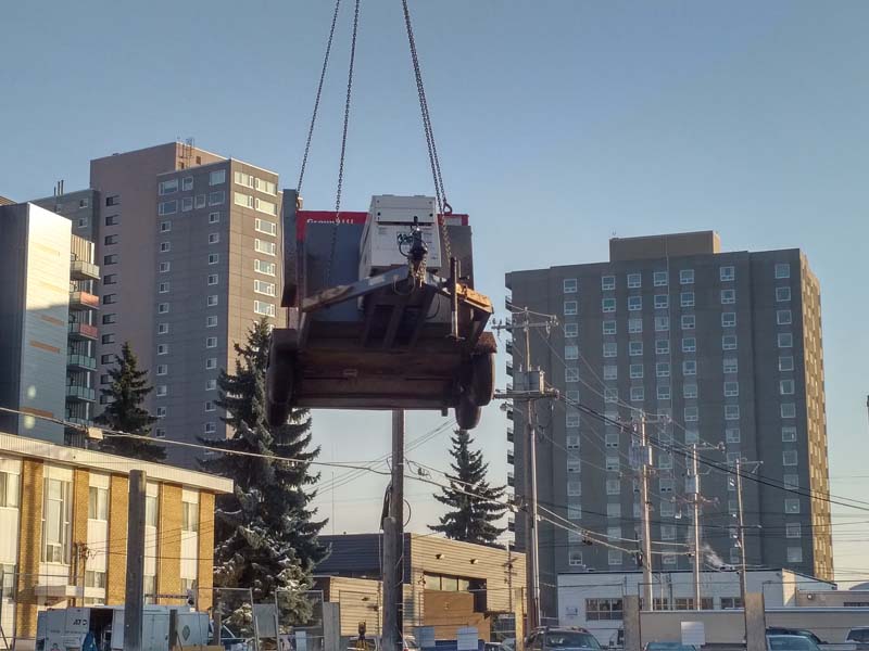 heater being lowered into coustruction site