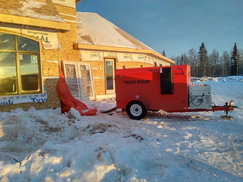 orange heat king heater at coustruction site side view